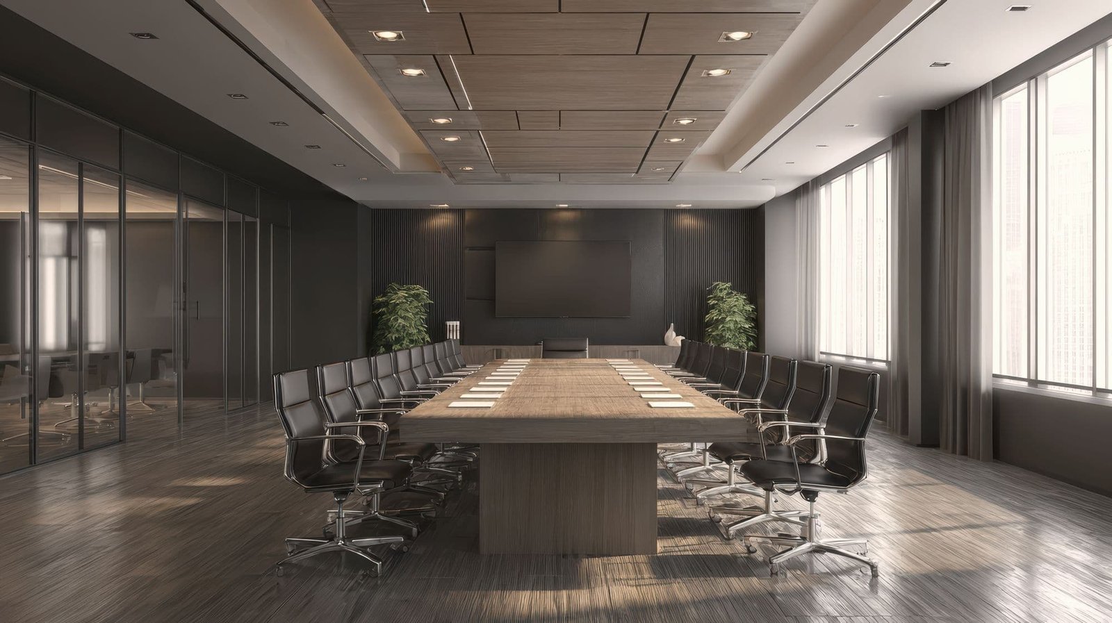 A boardroom with a long conference table under natural light